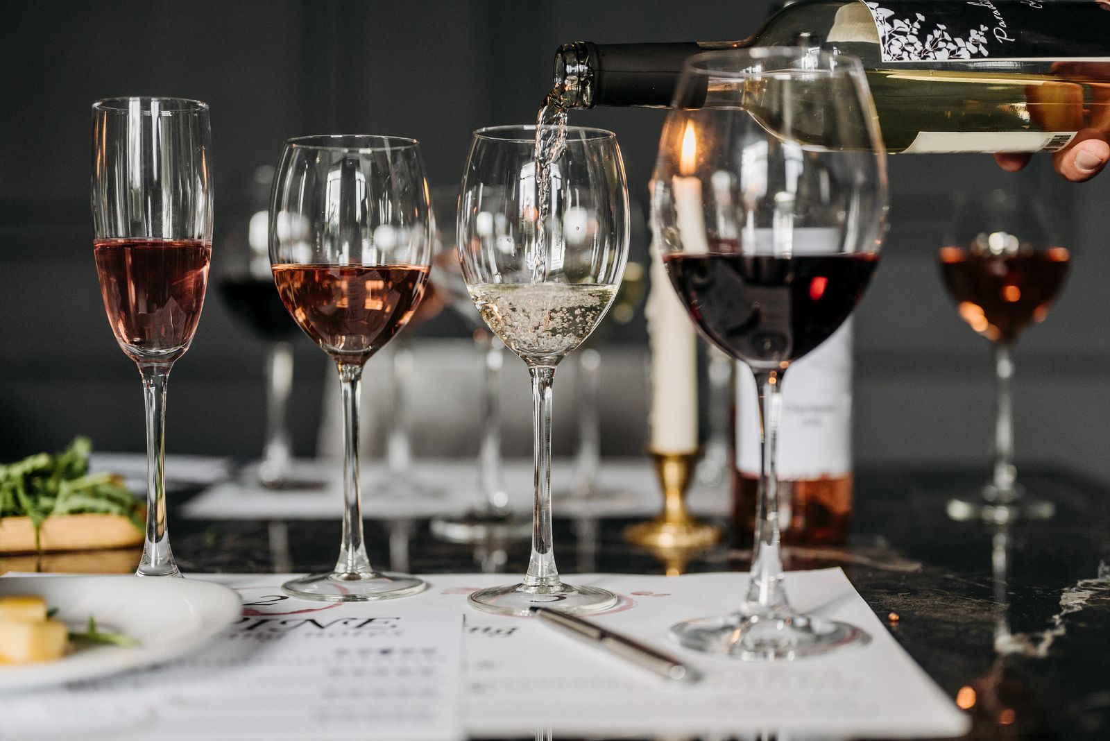 Wine glasses set for a tasting dinner, a theme among the types of cruises for adults