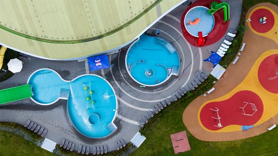 Aerial view of colorful children&rsquo;s pools and play areas